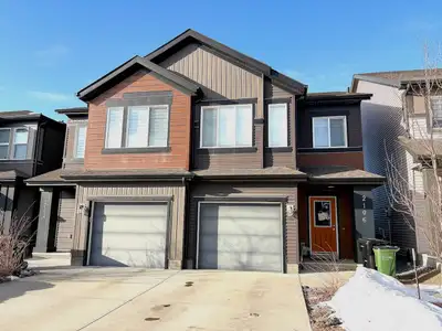 Welcome to this modern and well kept 4 bedroom, 3.5 bathroom half duplex in the desirable community...