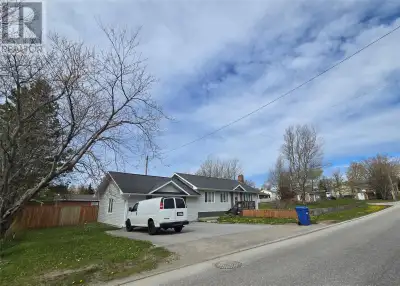 This charming 3 bedroom, 2 bath bungalow sits on nearly half an acre in the middle of town! Walking...