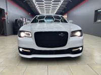 The 2023 Chrysler 300, particularly the 300C RWD in pristine white, is a powerful sedan that truly s... (image 3)