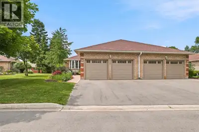 Beautiful end unit bungalow condo with a double car garage! The welcoming front patio is a perfect s...
