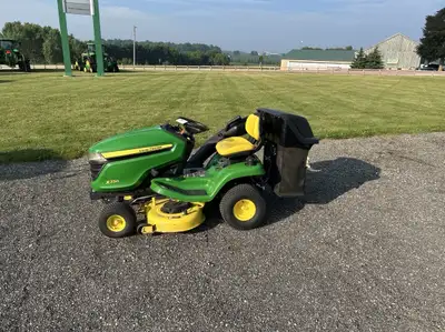 2017 John Deere X330 Lawn Tractor with 42” Deck, Bagger Stock Number: 186178 Hours: 274 Price: $4,39...