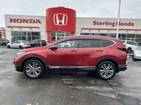Command the road in the breathtaking Radiant Red Metallic 2021 Honda CR-V Touring, a sophisticated s... (image 7)