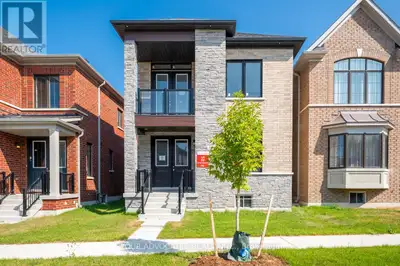 This brand new pre-construction detached home features an open concept kitchen with breakfast area a...