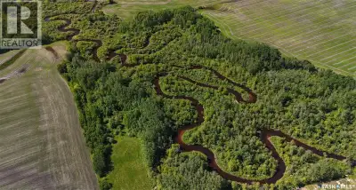 Waterfront Acreage on the Fir River — 58.34 Acres in the RM of Hudson Bay This rare riverfront parce...