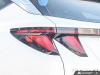 The 2023 Hyundai Tucson Preferred, featuring a brilliant Crystal White exterior complemented by a re... (image 7)