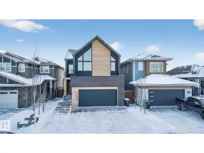 Stunning Scandinavian-inspired former showhome backing onto greenspace and Father Leduc School Park....