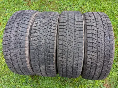Four 215/65R17 Bridgestone Blizzack WS90 tires all in excellent condition.