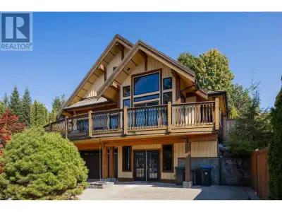 Custom built craftsmen retreat with stunning wood beams in a chalet style residence! Meticulously bu...