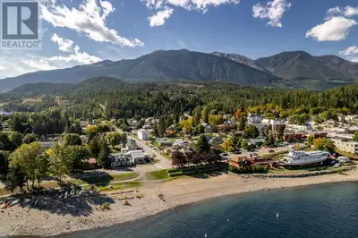 Discover your dream home in downtown Kaslo, BC, located just across the street from the beach with s...