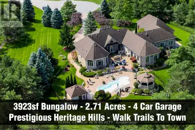 Rare 3923sf Elegant Tuscan Styled Bungalow Estate on a 2.71 acre mature forest lot fabulously locate...
