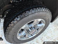 The new 2026 GMC Sierra 2500HD SLT in a bright white finish with 44 drivetrain is engineered for the... (image 7)
