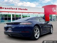 Feel the exhilaration of the open road with this stunning 2020 Porsche 718 Cayman in vibrant Gentian... (image 5)