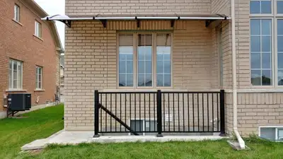 POLYCARBONATE SINGLE PANEL CUSTOMIZED AWNINGS FABRICATED IN CANADA. Brackets are manufactured with p...