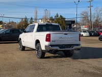 The 2026 Ram 1500 Longhorn Crew Cab in Ivory Tricoat Pearl combines rugged capability with refined l... (image 3)