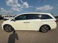 2014 Honda Odyssey Touring — White exterior, Brown interior. This Odyssey is powered by a 3.5L V6 th... (image 3)