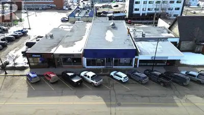 An amazing deal on this solid Concrete block building with full usable basement. Located in a update...