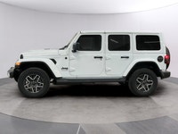 Experience the rugged charm of the new 2026 Jeep Wrangler Sahara 4 Door 4x4 in a striking white fini... (image 1)