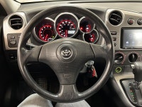 Silver light glances off the Titanium Metallic paint as it moves, the compact hatchback shape cuttin... (image 9)