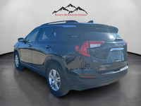 Meet the 2024 GMC Terrain AWD SLE in black, a capable SUV that offers all-wheel driving confidence o... (image 2)
