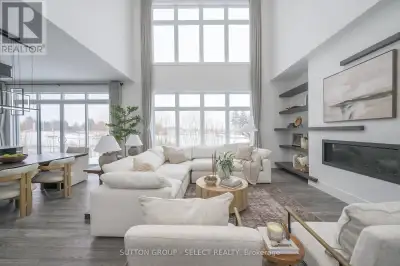 Striking modern residence on a premium lot backing onto protected green space and a picturesque stre...