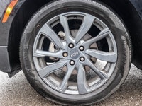 Experience the dynamic drive of the 2022 Chevrolet Equinox AWD RS in a striking black shade with adv... (image 5)