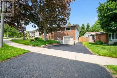 Located on a mature tree lined street.... this well-maintained raised bungalow is the perfect family...