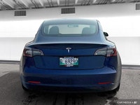 The 2021 Tesla Model 3 offers LED auto-leveling headlights, a panoramic sunroof, and aluminum wheels... (image 3)