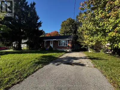 Investor Alert! Brick Bungalow with Separate Lower-Level Entrance on a 54' x 230' Lot. This well-loc...