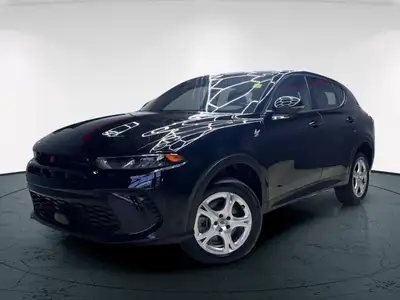 Introducing the 2024 Dodge Hornet GT AWD, a dynamic SUV that commands attention with its black-on-bl...