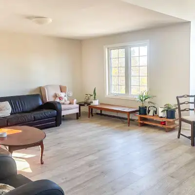 This bright space is modern and inviting, it is located up an interior stair from front entrance of...