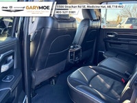 The 2023 Ram 2500 Laramie, in a striking black finish and equipped with a robust 4x4 drivetrain, pro... (image 7)