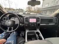 The 2022 Ram 1500 Classic Express, presented in a pristine white finish, is equipped with a robust 4... (image 7)