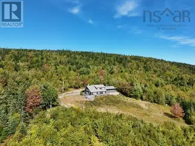 This grand property features a fabulous south-facing 3-BR chalet with attached garage nestled on 175...