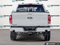 Introducing the 2026 Ford F-150 Tremor, dressed in a stunning white exterior and equipped with a rob... (image 5)