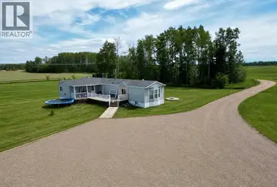 Escape to the peace and quiet of country living with this private 10-acre acreage located in the des...