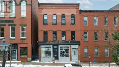 Step into charm and modern function, all in the perfect uptown location The main level features an i...