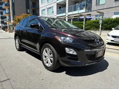 This 2011 Mazda CX-7 in eye-catching Purple is a sporty and versatile SUV that combines stylish desi...