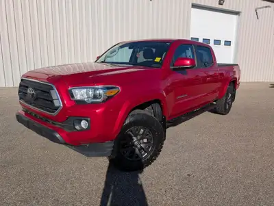 The 2022 Toyota Tacoma 4x4 Double Cab Auto in a striking red finish commands both attention and the...