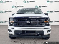 The 2026 Ford F-150 XLT, dressed in a striking Oxford White finish, showcases a commanding 4x4 drive... (image 2)