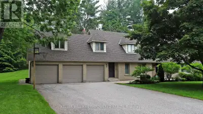 Own your own slice of paradise on 1.15 acres in the prestigious estate community of Woodland Acres!...
