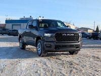 The 2026 Ram 1500 Big Horn Crew Cab in Granite Crystal Metallic combines rugged capability with refi... (image 8)