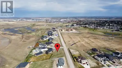This pie-shaped .27 acre lot in a bay is just minutes from Regina, offering city amenities and small...