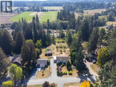 An exceptional opportunity for multi-family living or rental income—this one-acre South Wellington,...