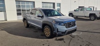 Our 2023 Honda Ridgeline Touring in Sonic Grey with the Honda Performance Development Package is in... (image 5)