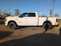 The 2026 Ram 2500 Laramie Crew Cab Night Edition in Bright White combines aggressive style, heavy-du... (image 2)