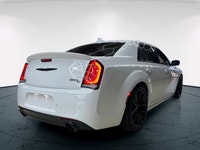 The 2023 Chrysler 300, particularly the 300C RWD in pristine white, is a powerful sedan that truly s... (image 4)