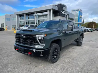 The 2026 Chevrolet Silverado 2500HD LT, draped in a sophisticated gray finish, comes equipped with a...