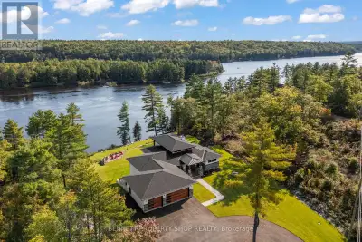 Perched high above the Ottawa River with sweeping, unobstructed views, this custom-built 4-bed, 3-ba...