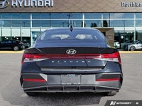 This 2024 Hyundai Elantra Essential shines with its sleek Abyss Black exterior and practical feature... (image 3)