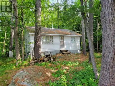 BOAT ACCESS ONLY. Tucked away on the shores of the Severn River, this rustic retreat offers natural...